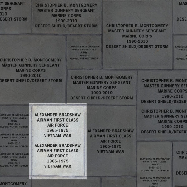 Image indicating two veterans recognized on a 17x23 inch paver. It demonstrates that the paver includes the veterans' name, rank, branch of service, years of service and theaters in which they served.